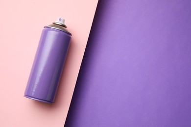 Can of spray paint on color background, top view with space for text. Graffiti supply