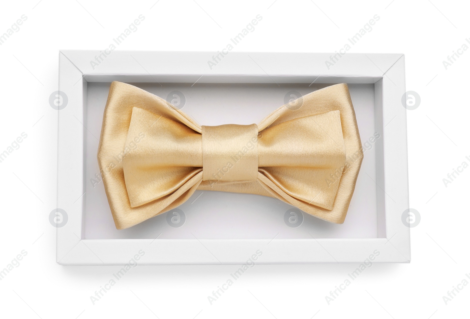 Photo of Stylish beige bow tie in box on white background, top view