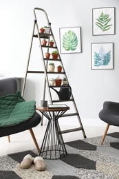 Stylish living room interior with decorative ladder