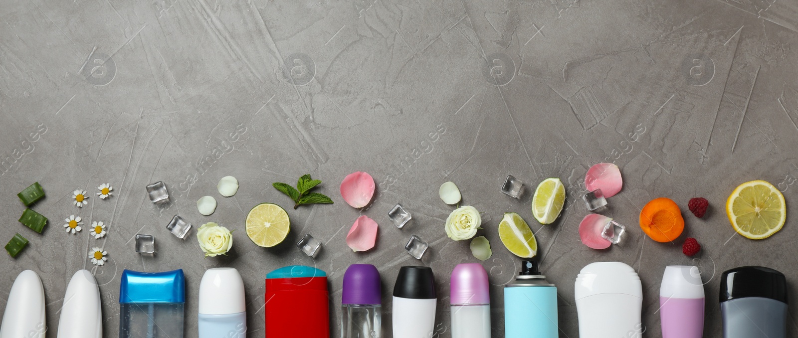 Photo of Flat lay composition with different natural deodorants and space for text on grey table