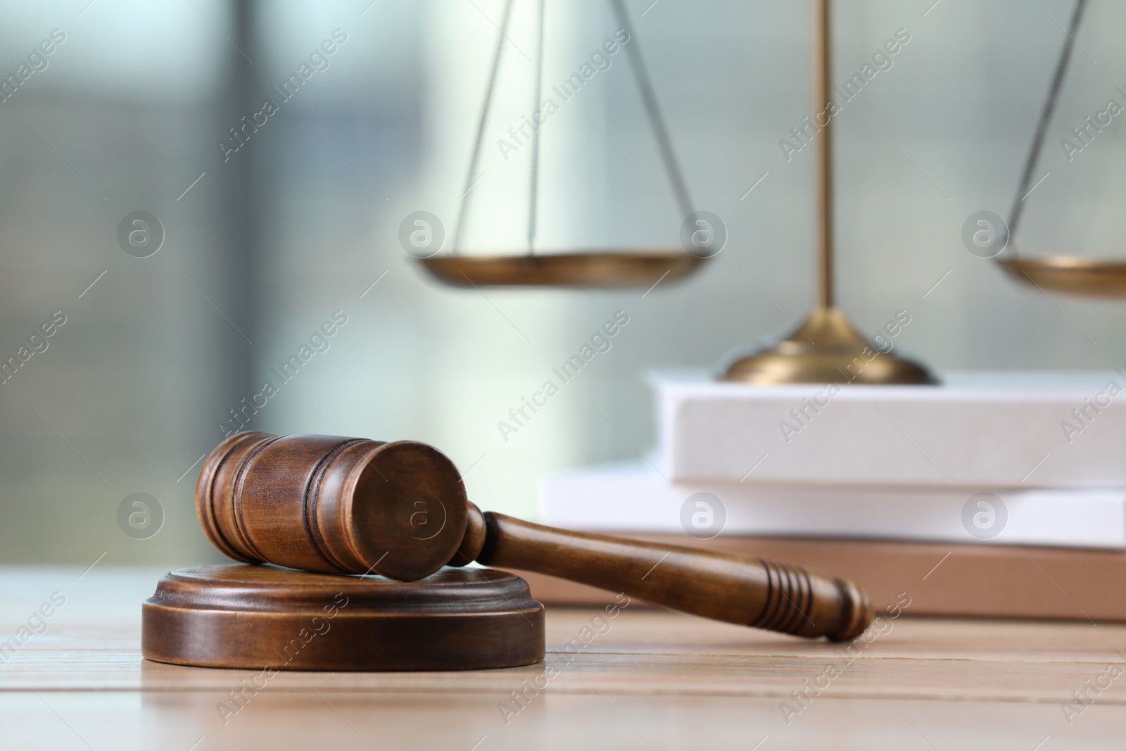 Photo of Wooden gavel on table indoors. Space for text