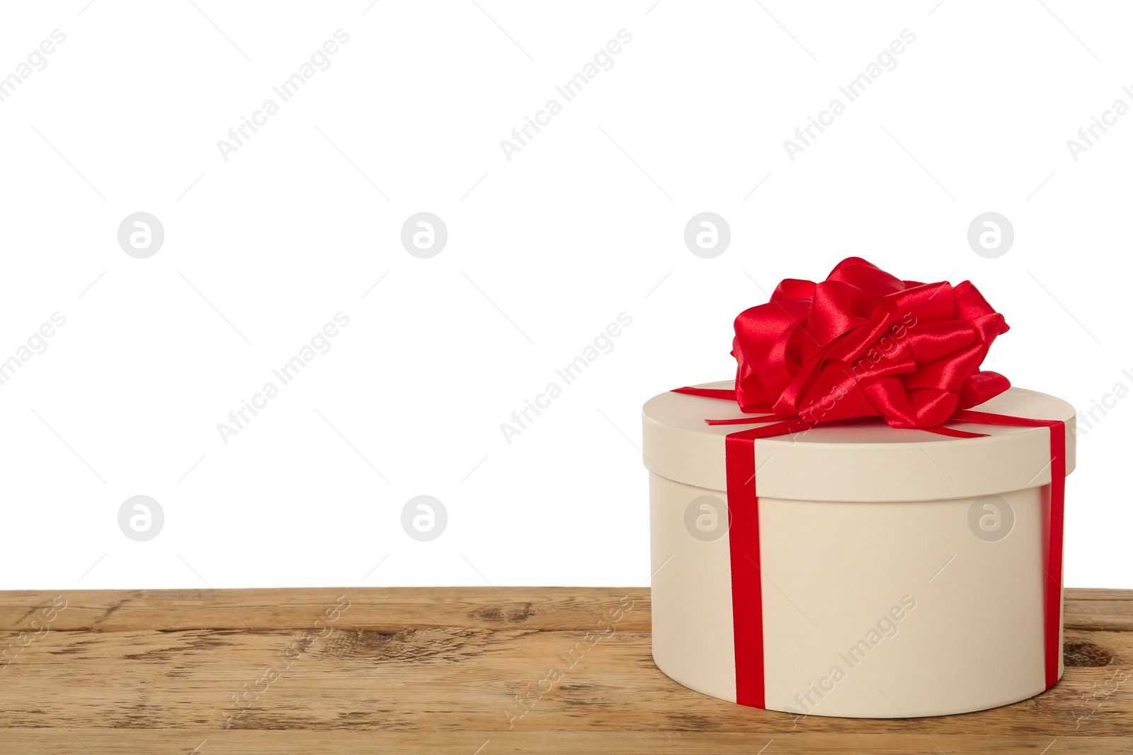 Photo of Beautiful gift box on wooden table against white background, space for text