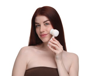 Photo of Washing face. Young woman with cleansing brush on white background