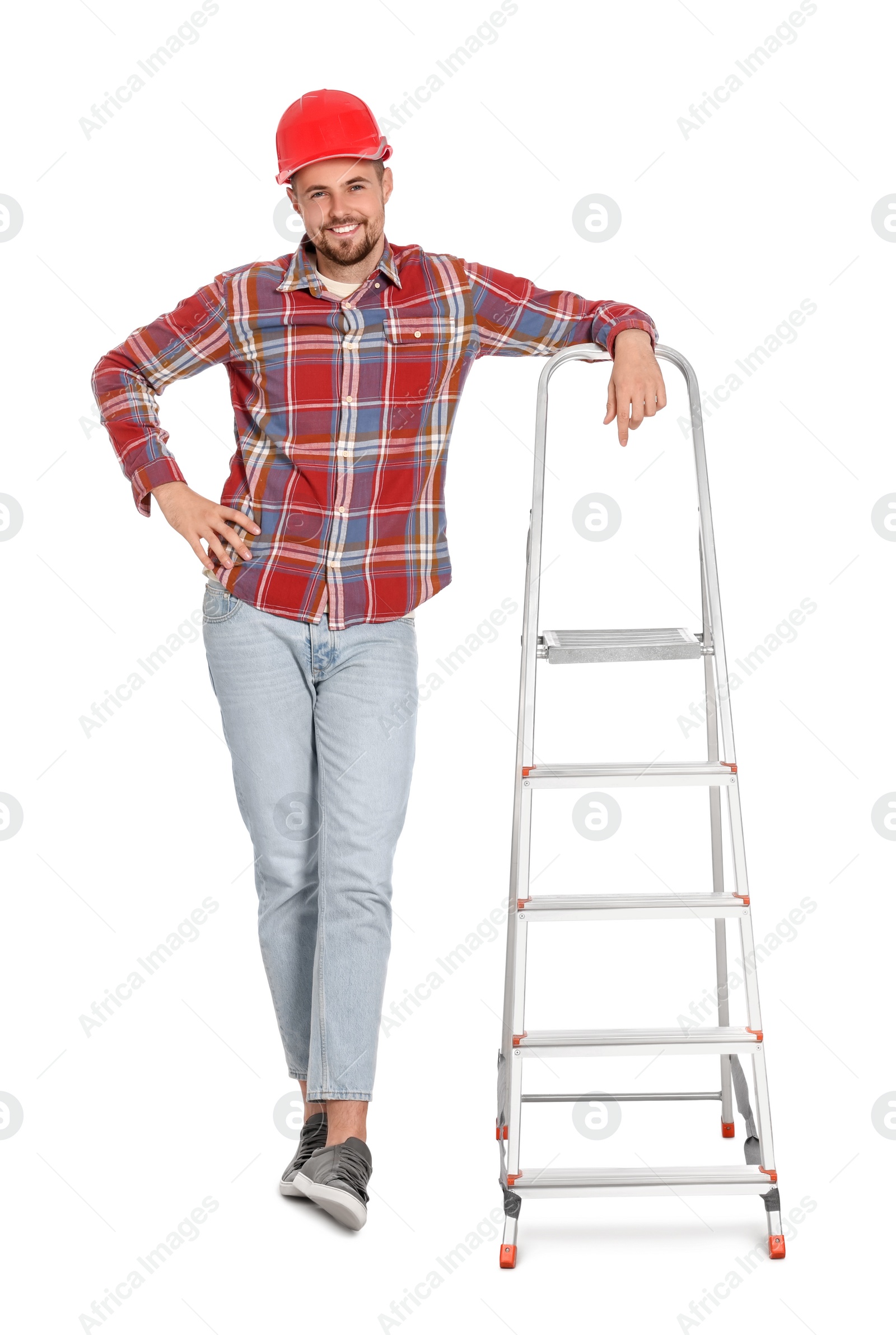 Photo of Young handsome man in hard hat near metal ladder on white background