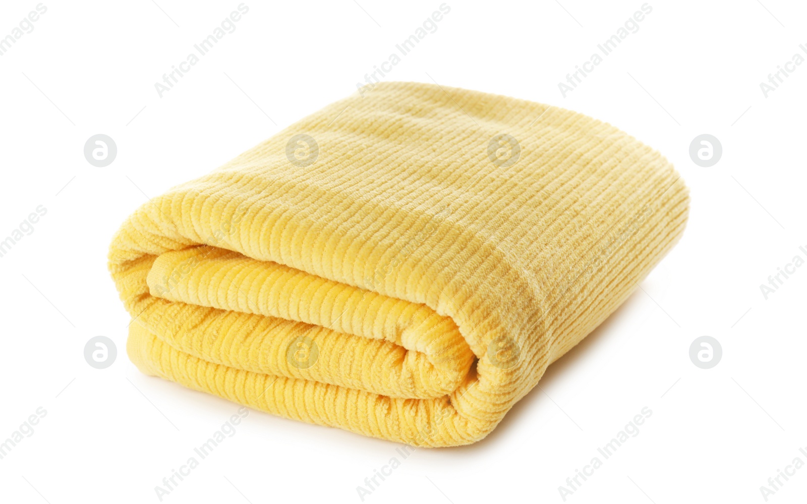 Photo of Folded yellow towel isolated on white. Beach object