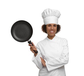 Photo of Happy female chef in uniform holding frying pan on white background