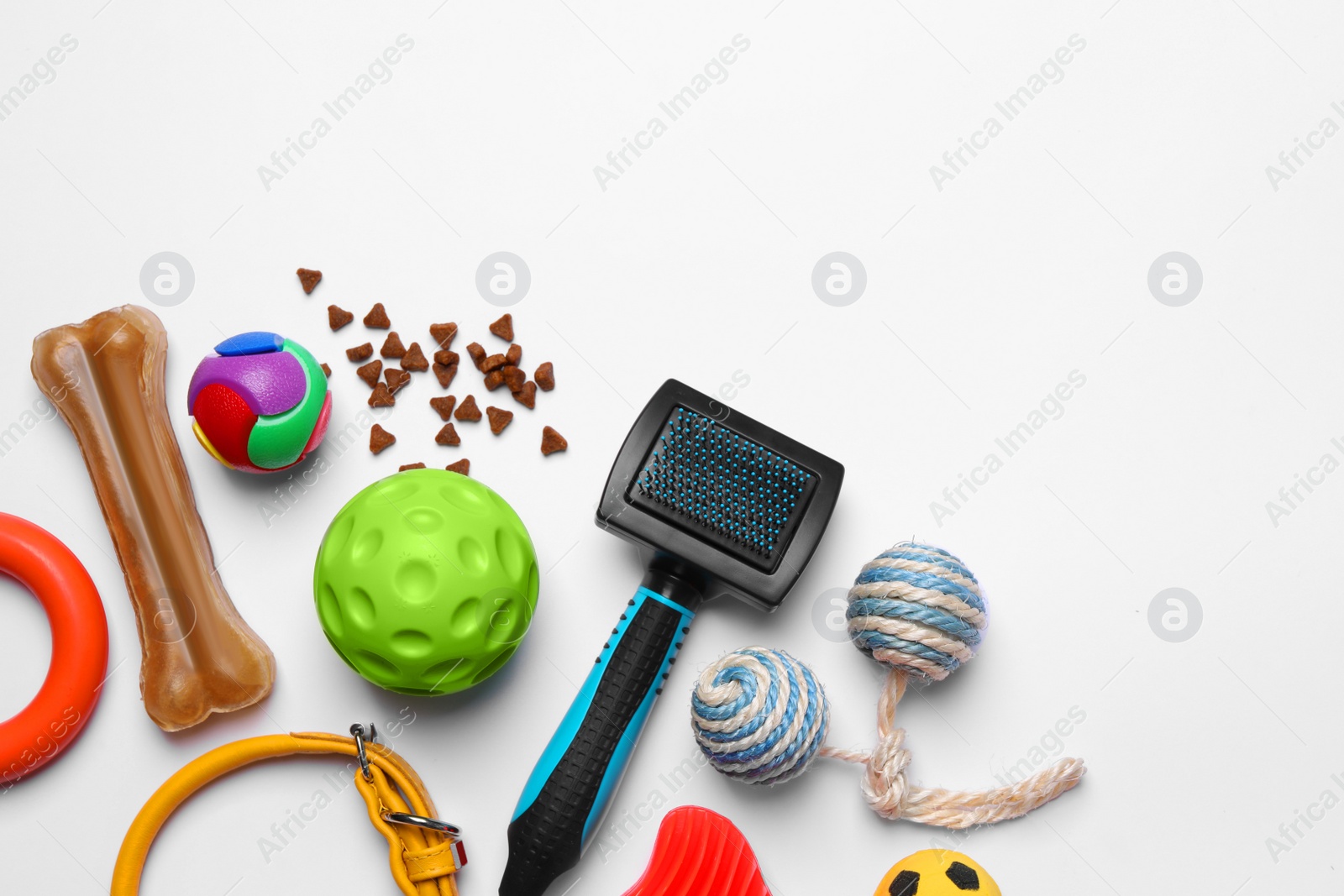 Photo of Flat lay composition with pet toys, food and accessories on white background, space for text