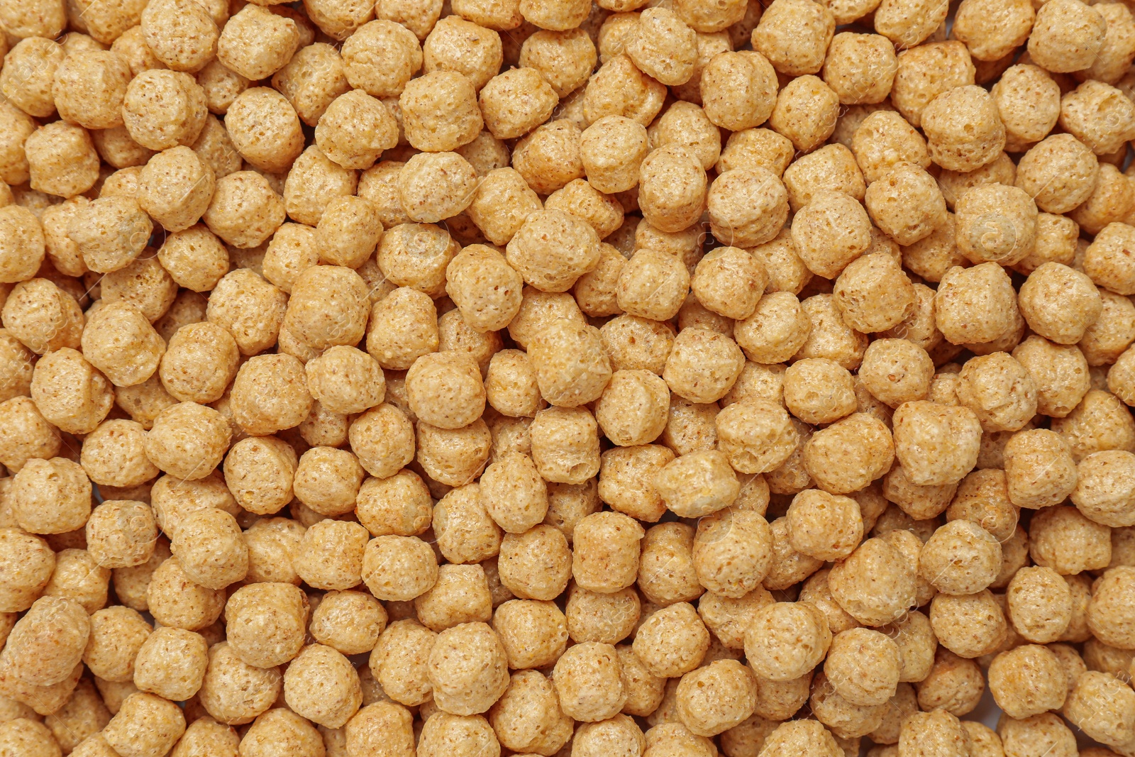 Photo of Sweet crispy corn balls as background, top view