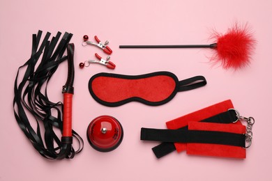 Photo of Sex toys and accessories on pink background, flat lay