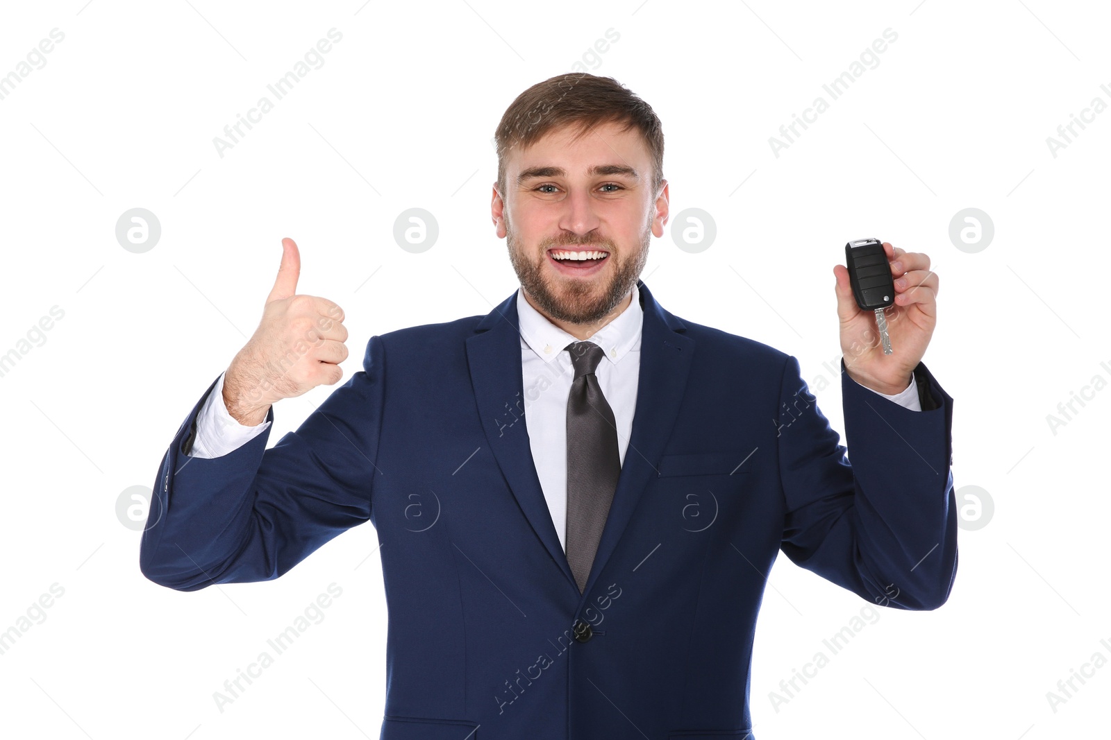 Photo of Happy young businessman with car key on white background