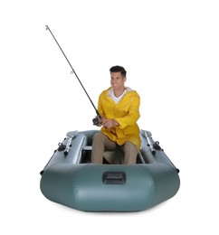 Photo of Man fishing with rod from inflatable rubber boat on white background