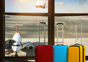Image of Travel suitcases in airport terminal. Summer vacation