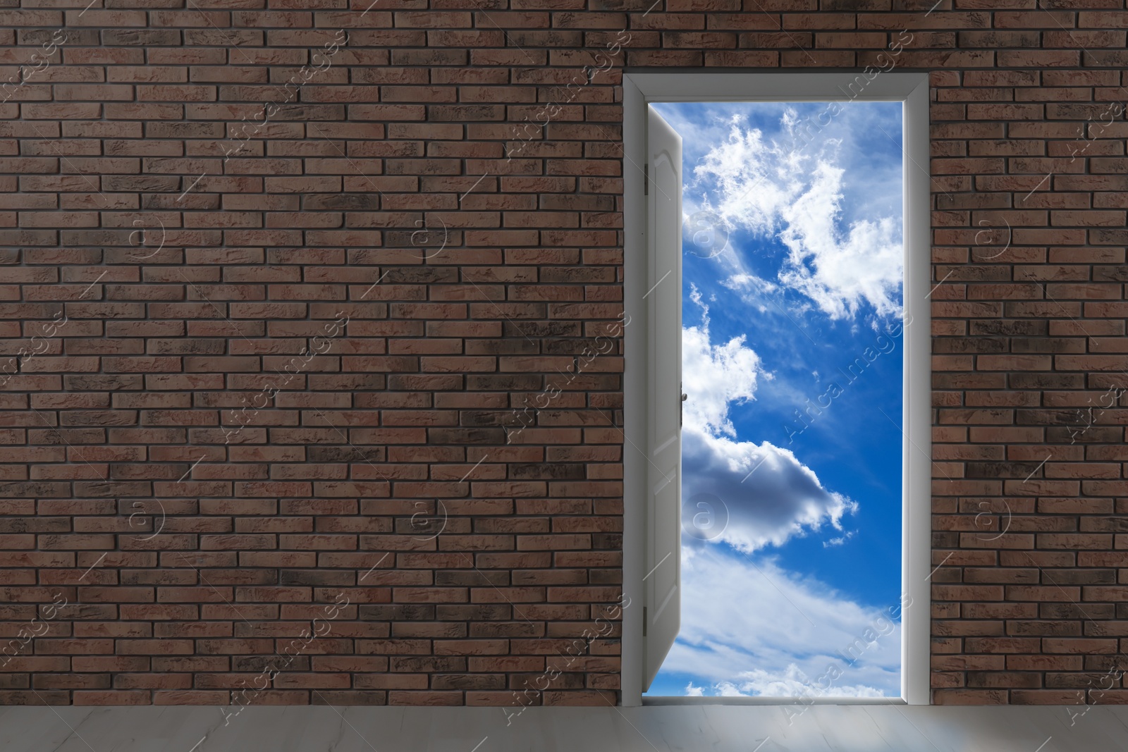 Image of Beautiful blue sky with fluffy clouds visible through open door