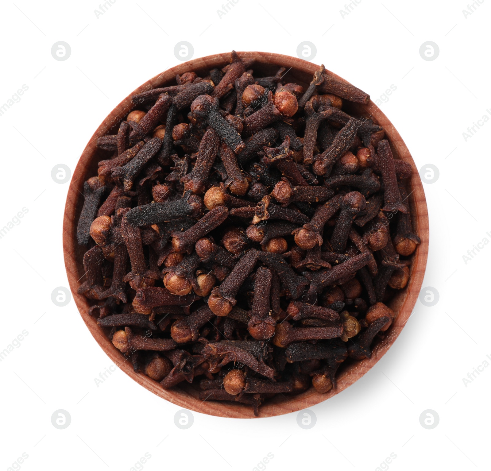 Photo of Aromatic dry cloves in wooden bowl isolated on white, top view