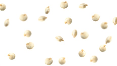 Many quinoa seeds falling on white background, banner design. Vegan diet 