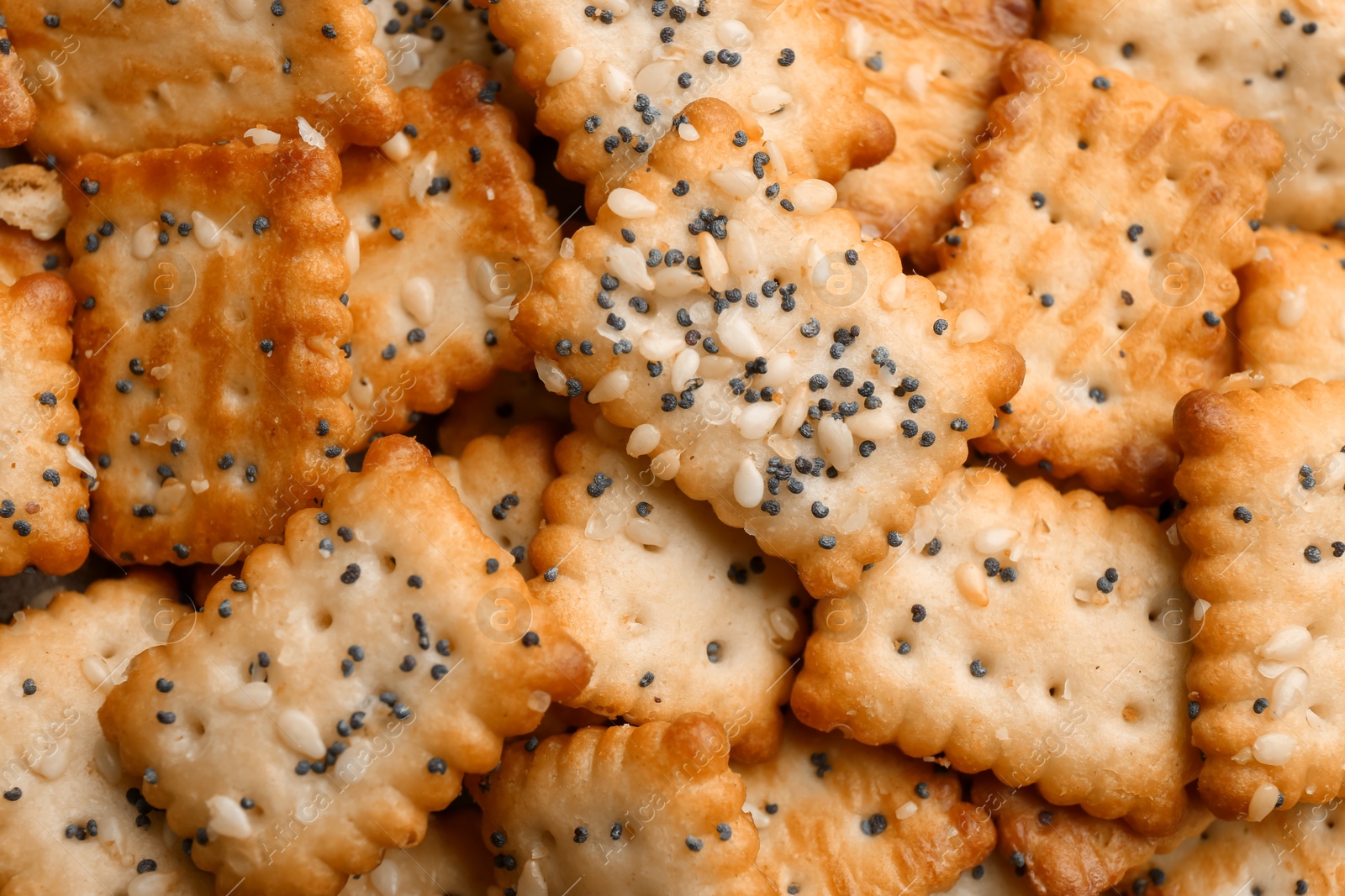 Photo of Many delicious crackers as background, top view