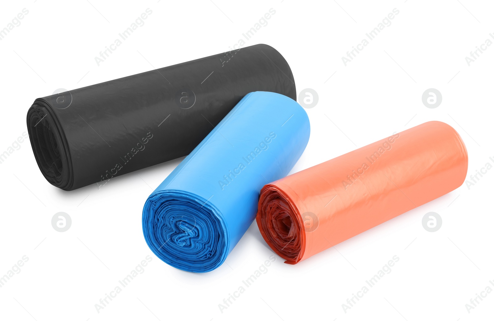 Photo of Rolls of different color garbage bags isolated on white