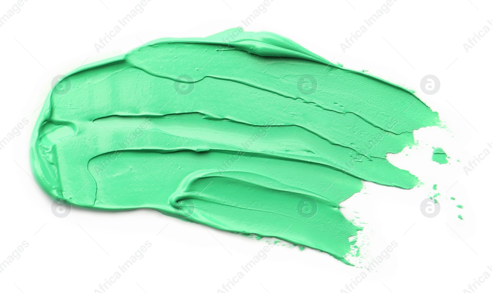 Photo of Green oil paint stroke on white background, top view