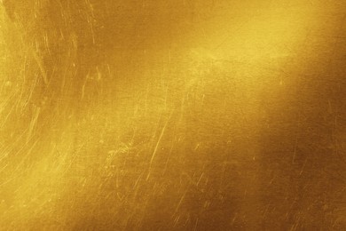 Image of Golden textured surface as background, closeup view