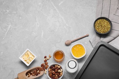Photo of Ingredients for making delicious baklava on grey textured table, flat lay. Space for text