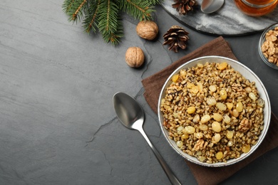 Traditional Christmas slavic dish kutia served on black table, flat lay. Space for text
