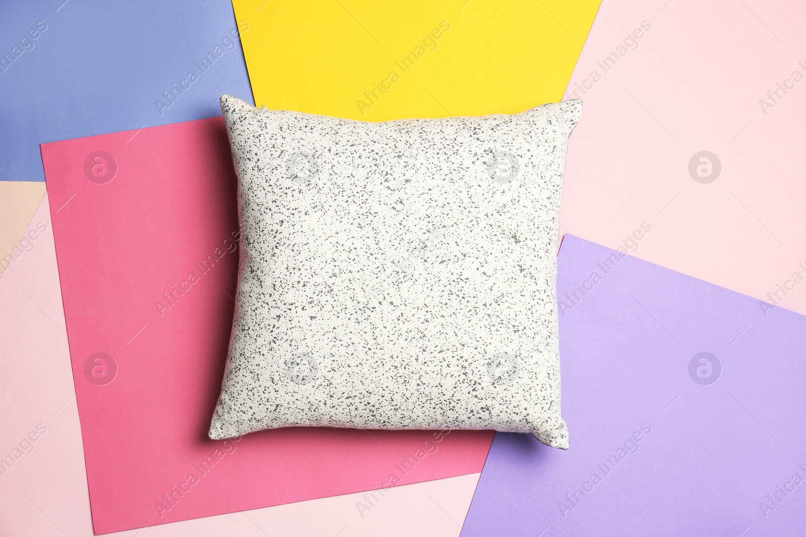 Photo of Soft decorative pillow on color background, top view