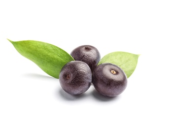 Fresh acai berries with leaves on white background