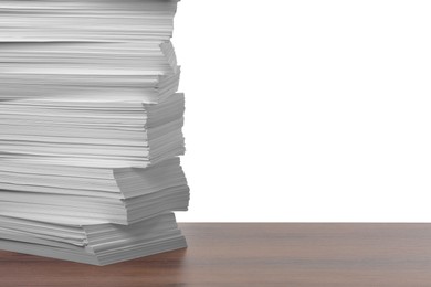 Photo of Stack of paper sheets on wooden table against white background. Space for text