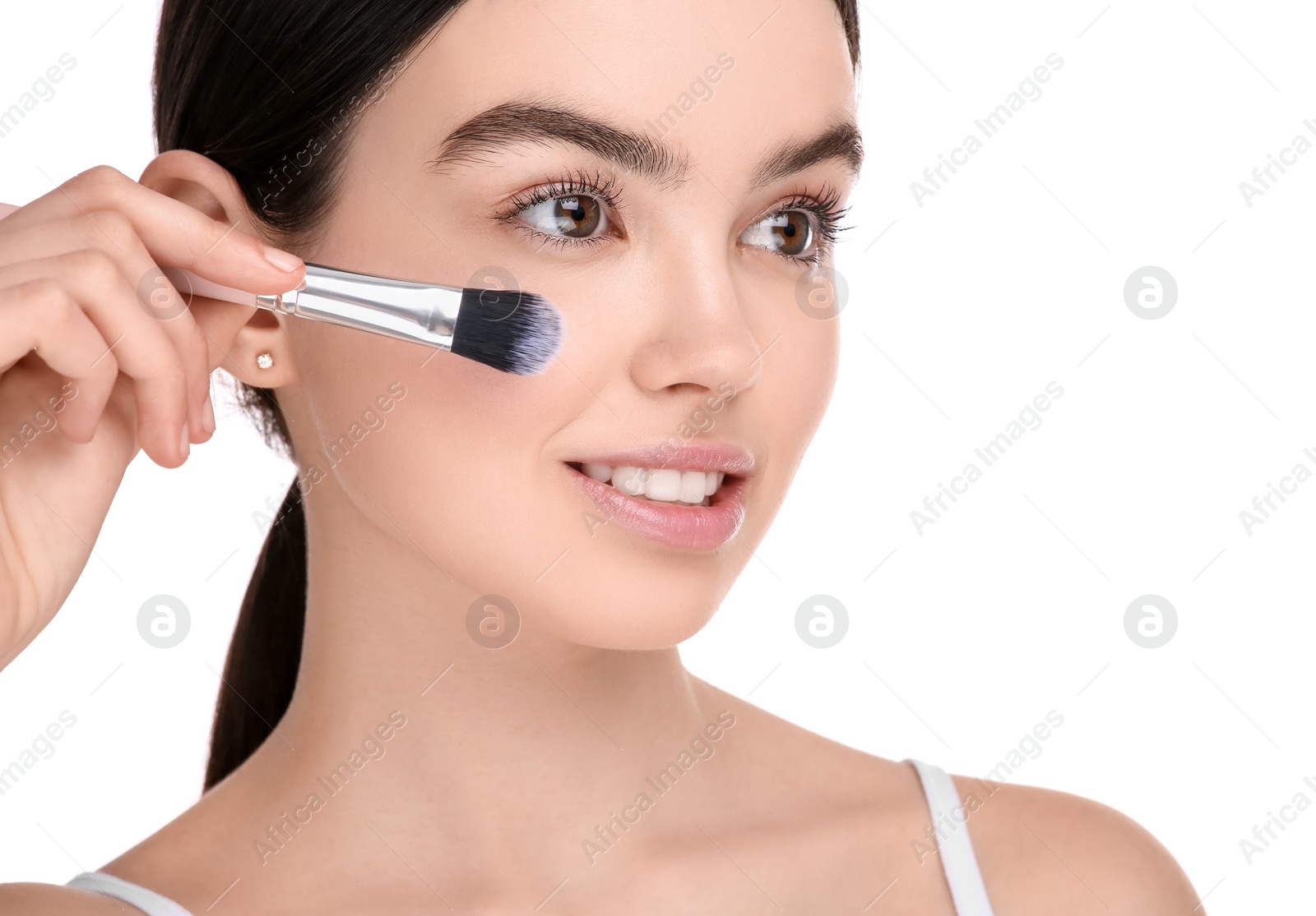 Photo of Teenage girl with makeup brush on white background