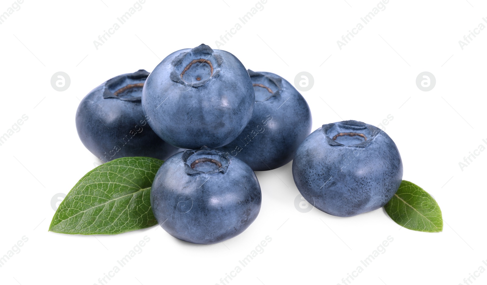 Photo of Pile of fresh ripe blueberries and leaves isolated on white