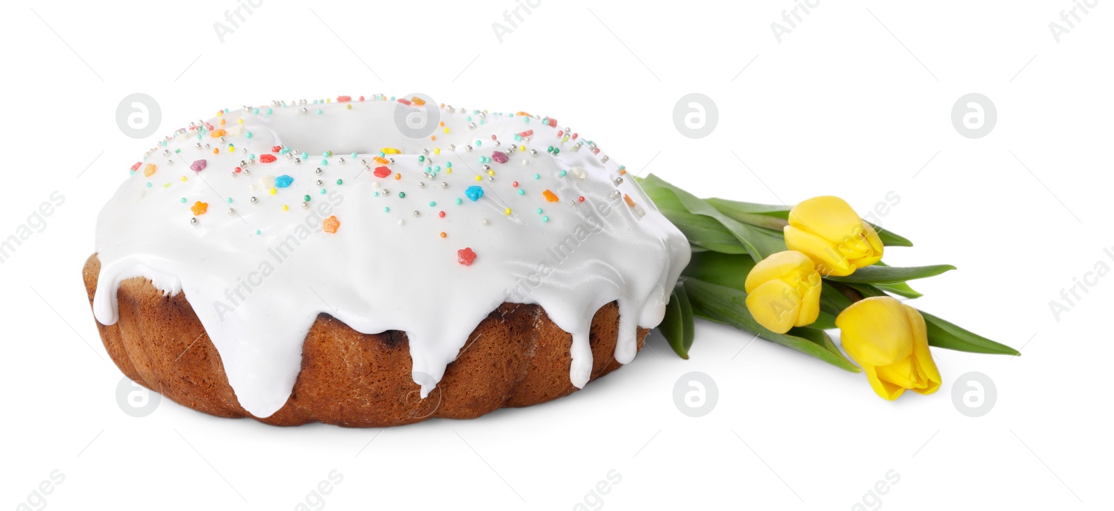 Photo of Easter cake with sprinkles and yellow tulips isolated on white