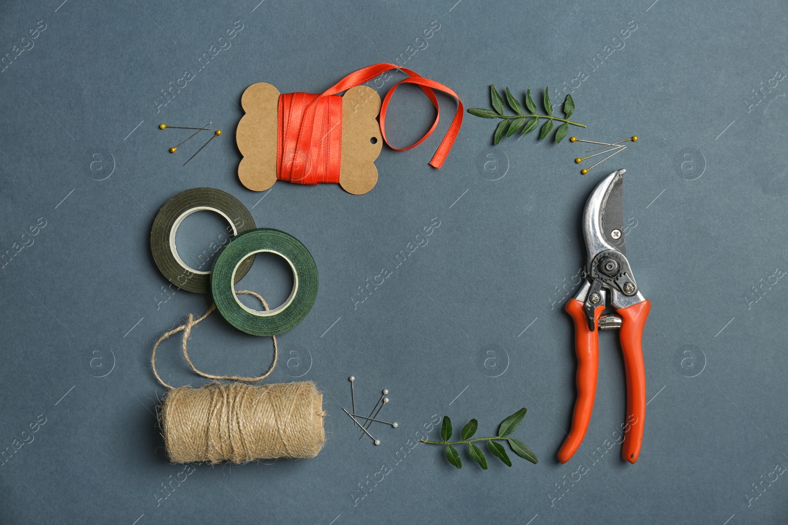 Photo of Florist equipment on color background, top view