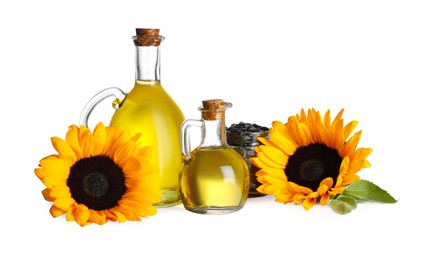 Photo of Sunflower cooking oil, seeds and yellow flowers on white background