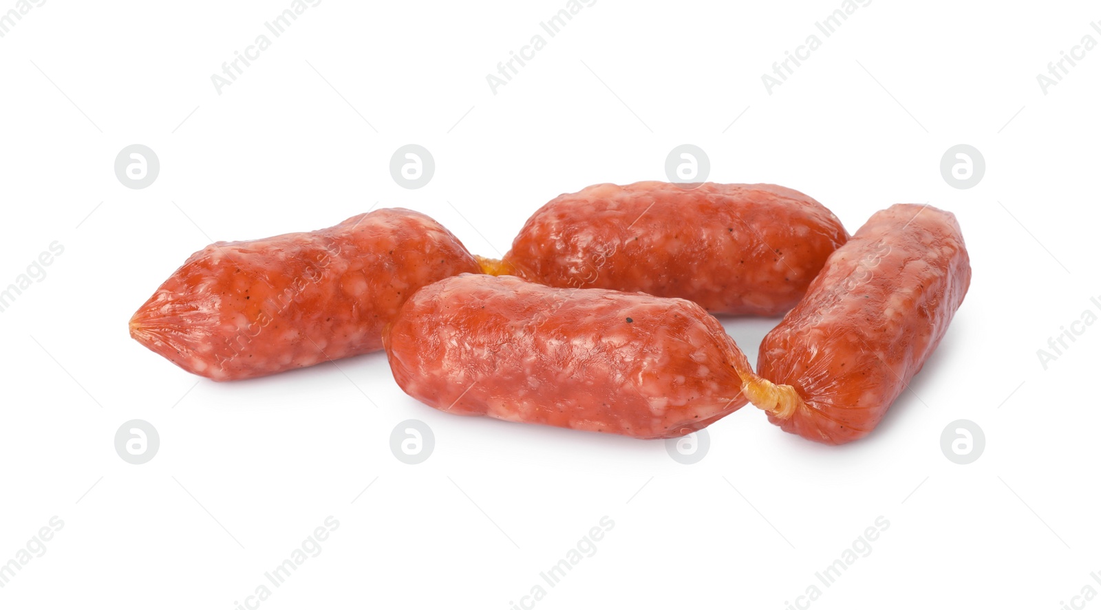 Photo of Thin dry smoked sausages isolated on white