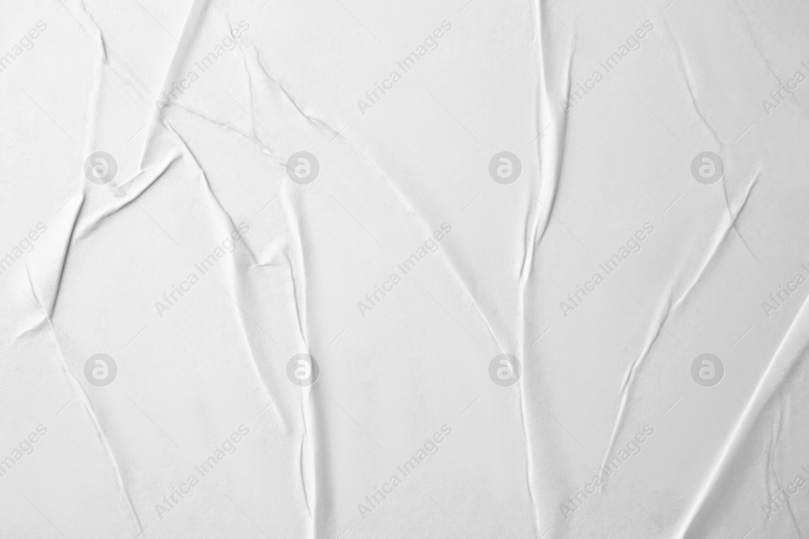 Photo of Texture of white creased paper, closeup view