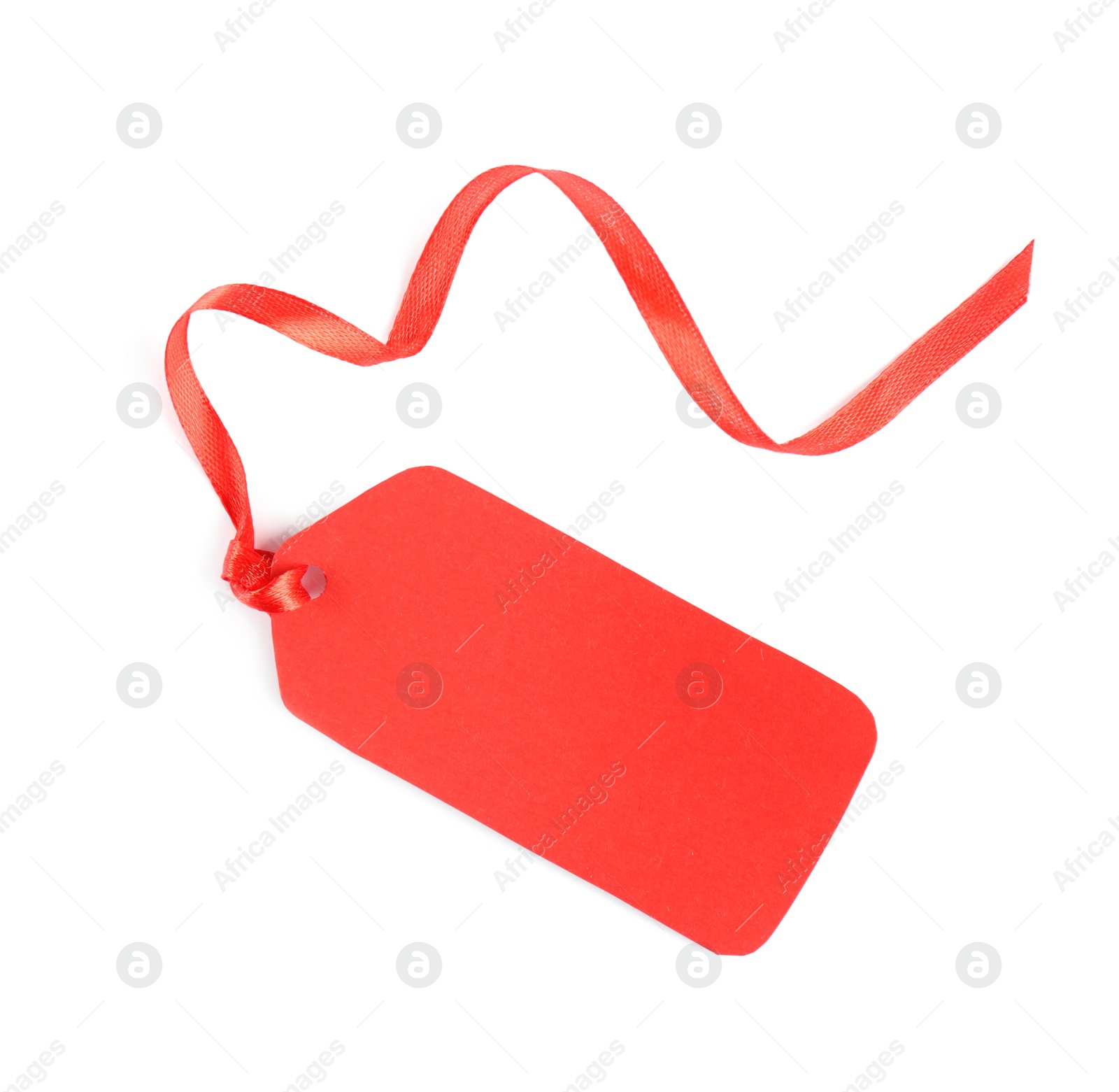 Photo of Blank red gift tag with satin ribbon on white background, top view