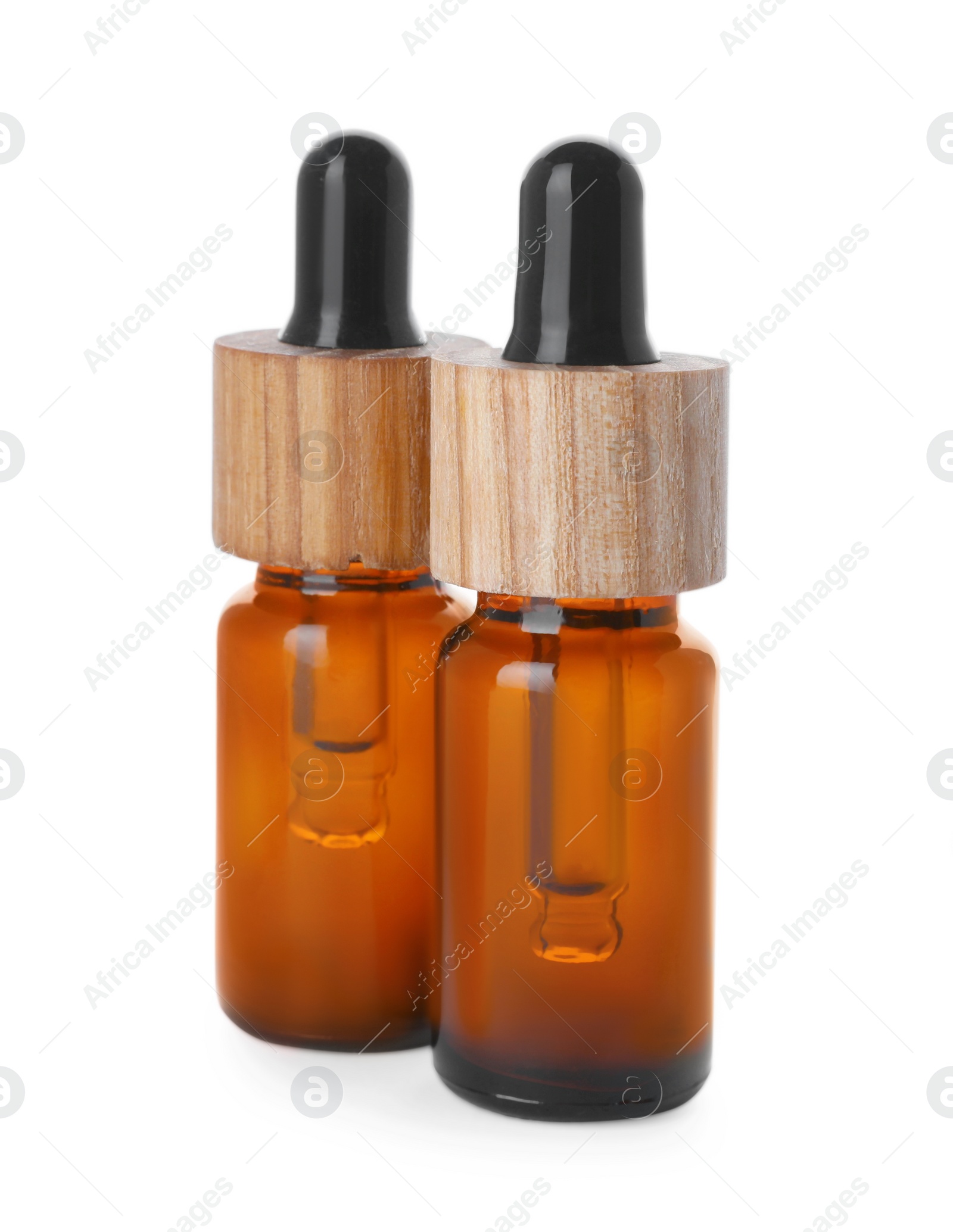 Photo of Bottles of essential oil on white background