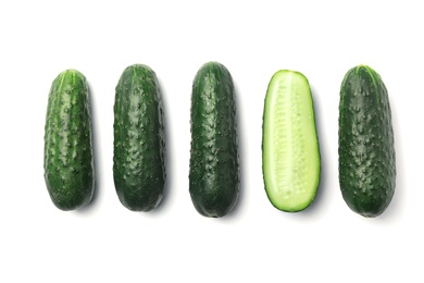 Photo of Flat lay composition with ripe cucumbers on white background