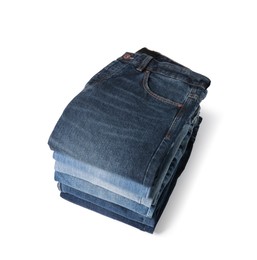 Image of Stack of different folded jeans isolated on white