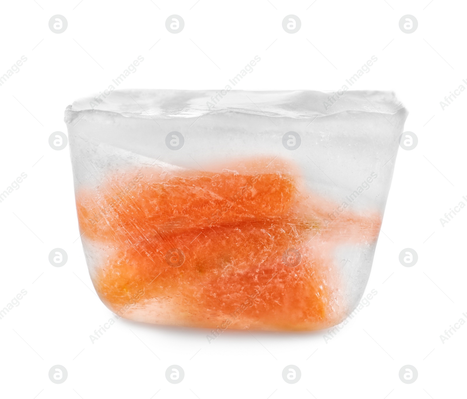 Photo of Fresh carrot in ice cube on white background. Frozen vegetables