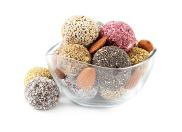 Photo of Different delicious vegan candy balls with almonds on white background