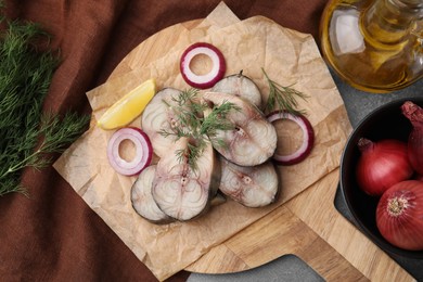 Slices of tasty salted mackerel served on table, flat lay