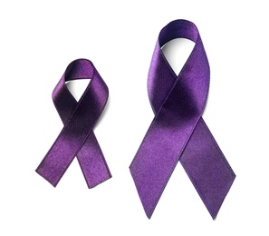 Purple ribbon on white background, top view. Domestic violence awareness