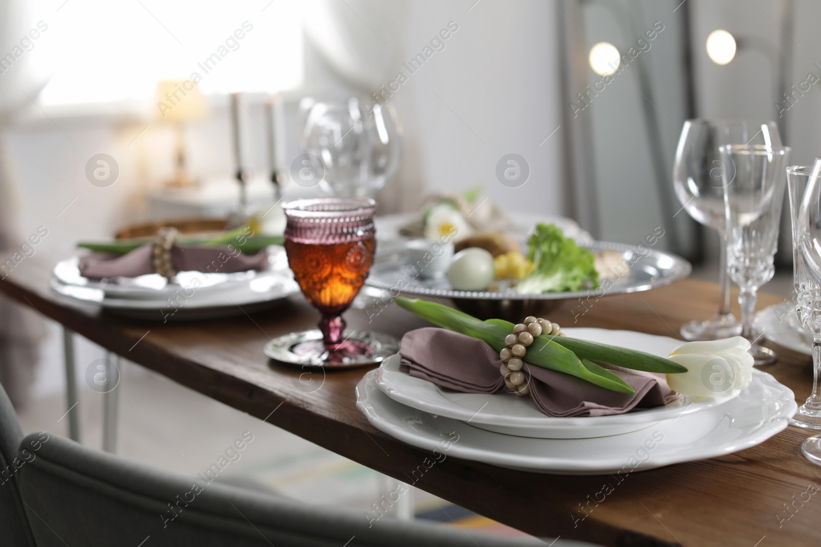 Photo of Festive Passover table setting at home. Pesach celebration