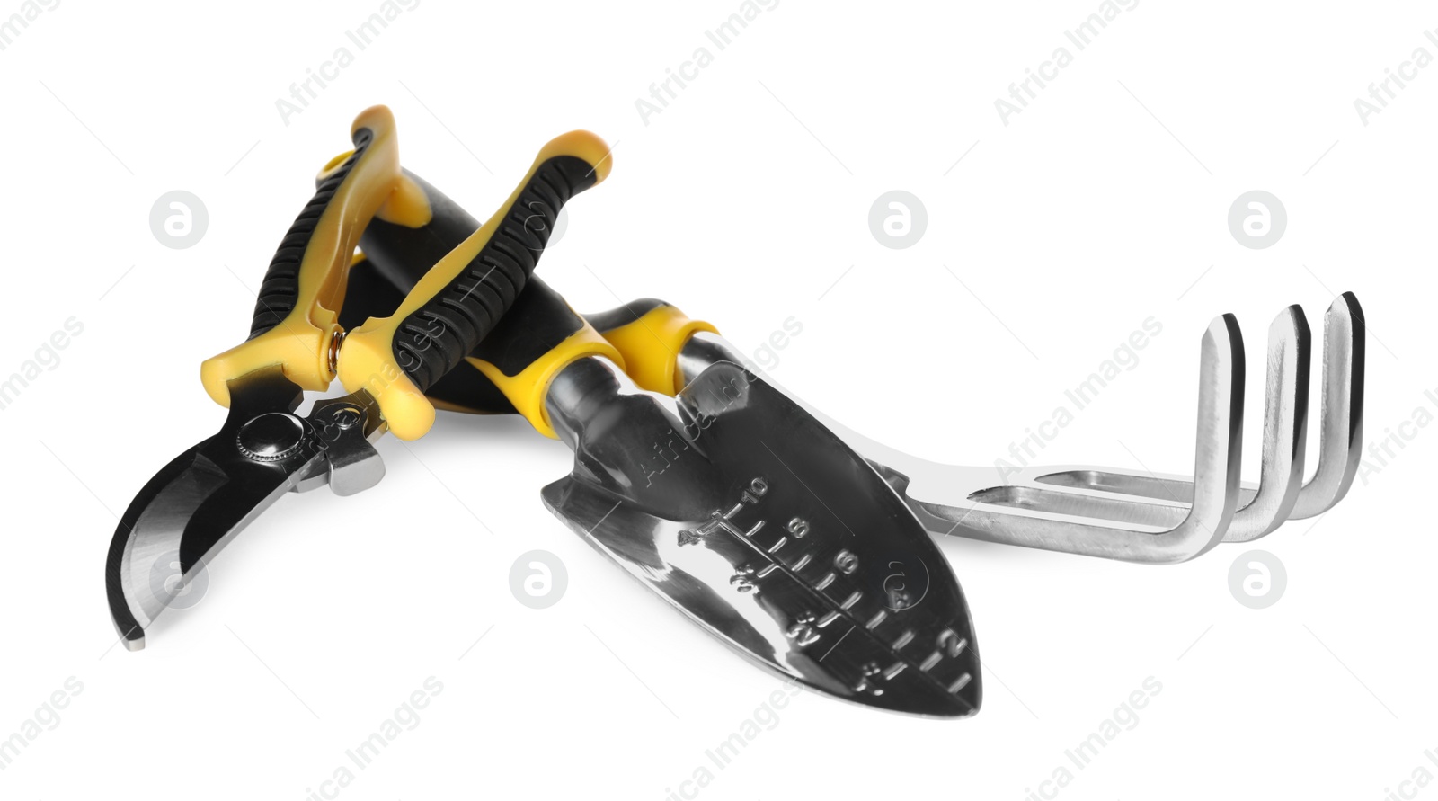 Photo of Trowel, pruning shears and rake on white background. Gardening tools