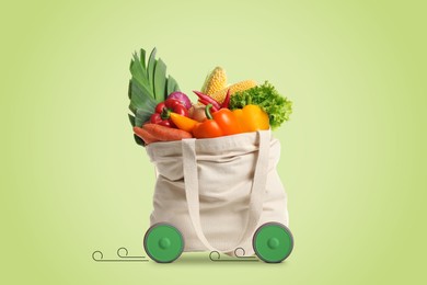 Image of Shopping bag full of products on wheels against light green background. Order hurrying to client. Food delivery service