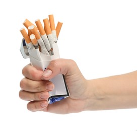 Photo of Stop smoking. Man holding pack with cigarettes on white background, closeup