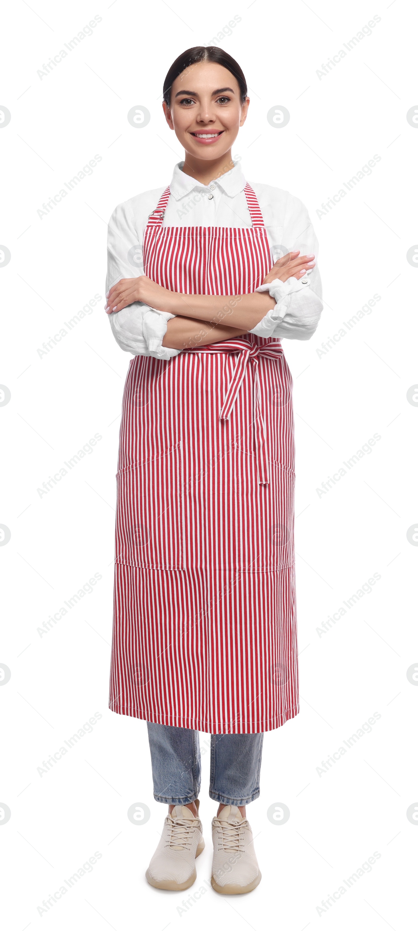 Photo of Young woman in red striped apron on white background