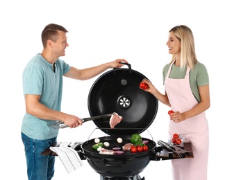 Happy couple cooking on barbecue grill, white background