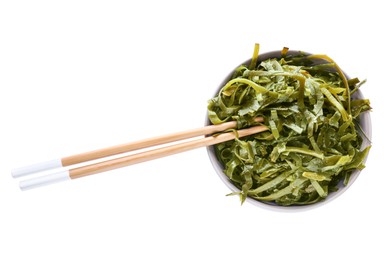 Fresh laminaria (kelp) seaweed in bowl and chopsticks on white background, top view